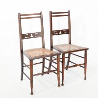 A Pair of Arts & Crafts Side Chairs with Stylized Tulip Cut-outs to the Back