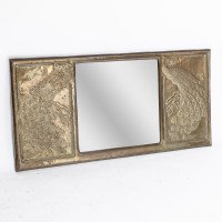 An Aesthetic Movement Brass Mirror with Stylized Peacocks Perched on a Branch