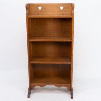 Liberty & Co., attributed. An Arts & Crafts Oak Bookcase with Stylized Heart Cut-outs - Thumbnail 2
