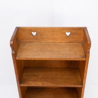 Liberty & Co., attributed. An Arts & Crafts Oak Bookcase with Stylized Heart Cut-outs - Thumbnail 6