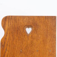 Liberty & Co., attributed. An Arts & Crafts Oak Bookcase with Stylized Heart Cut-outs - Thumbnail 8