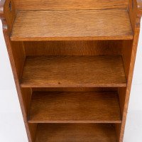 Liberty & Co., attributed. An Arts & Crafts Oak Bookcase with Stylized Heart Cut-outs - Thumbnail 9