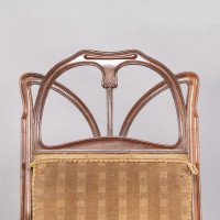 Louis Majorelle. An Art Nouveau Armchair in Carved Walnut Retaining the Original Period Fabric - Thumbnail 10