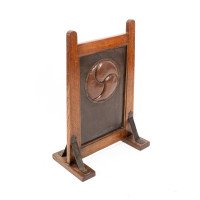 Leonard Wyburd, attributed. A Rare Arts & Crafts Oak Fire Screen by Liberty & Co