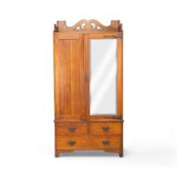 Liberty & Co., attributed. Arts & Crafts Oak Double Wardrobe with Stylized Cut-Outs