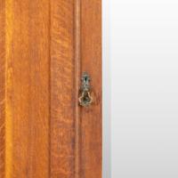 Liberty & Co., attributed. Arts & Crafts Oak Double Wardrobe with Stylized Cut-Outs - Thumbnail 12