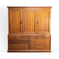 Morris & Co., attributed. An Arts & Crafts Oak Treble Linen Press, Metalwork by Rathbone