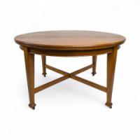 Jas Shoolbred (labelled). An Arts & Crafts Round Oak Dining Table