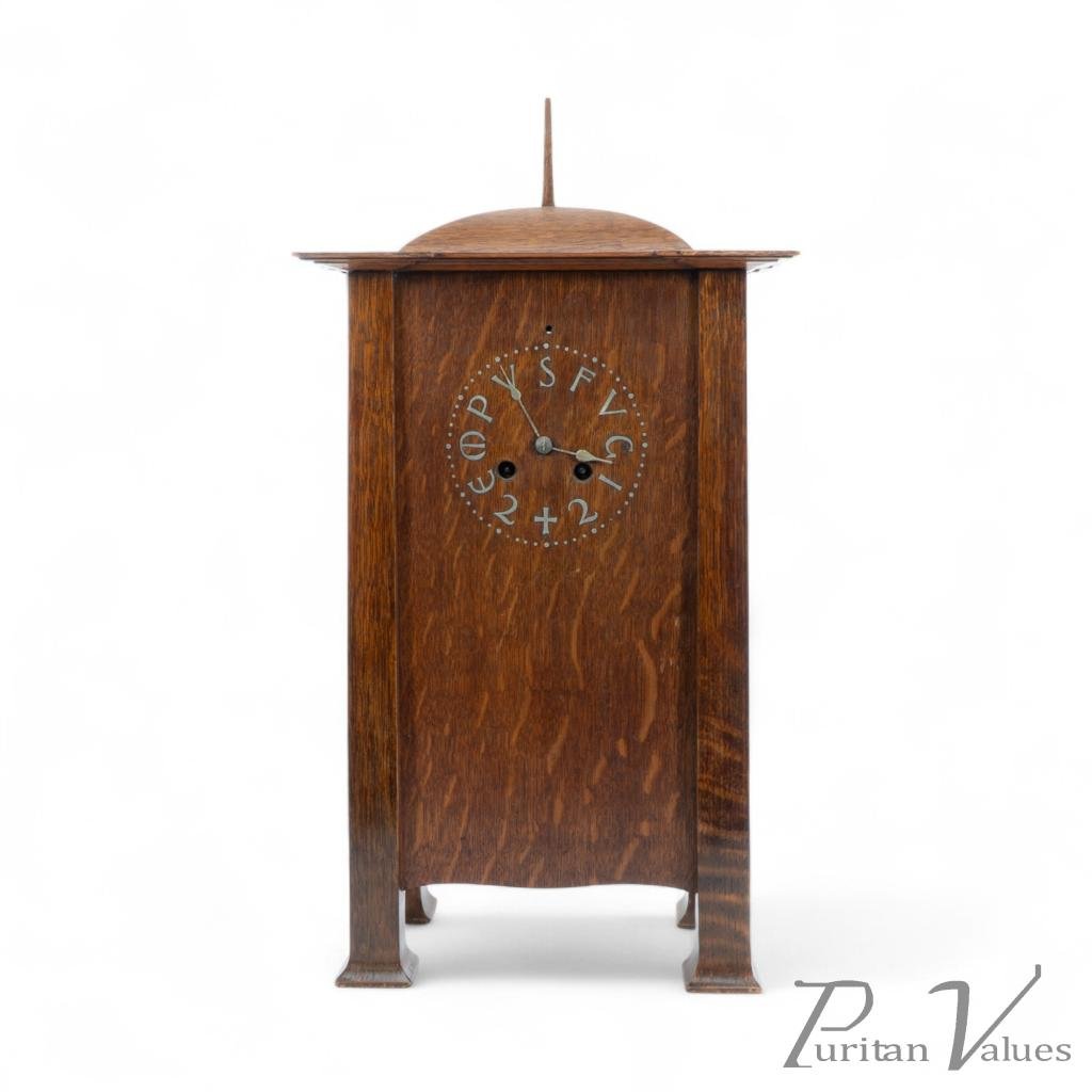 C. F. A. Voysey (1857–1941). Rare Arts & Crafts Oak mantel clock