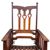 Liberty & Co., attributed. An Arts and Crafts Reclining Armchair with Carved Floral Details - Thumbnail 11