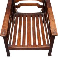 Liberty & Co., attributed. An Arts and Crafts Reclining Armchair with Carved Floral Details - Thumbnail 12