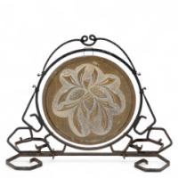 An Arts and Crafts wrought iron dinner gong with brass central plate decorated with wheatsheaf design