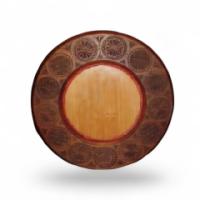 Liberty & Co., A Walnut Circular Mirror Frame with Hand Carved Moorish Circles