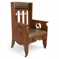 Goodyers of Regent St. An Arts & Crafts Oak Armchair with Stylized Decoration