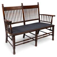 Bruce Talbert, attributed. An Aesthetic Movement Upholstered Love or Twin Window Seat