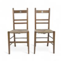 Liberty & Co., A Pair of Arts & Crafts Oak Rush Seat Chairs Inlaid with Pewter Hearts