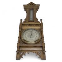 A Large Gothic Revival Carved Oak Barometer with a Rare Snail Tail Thermometer