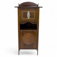 G. M. Ellwood. J. S. Henry & J M King, attributed. An Arts & Crafts Mahogany Music Cabinet