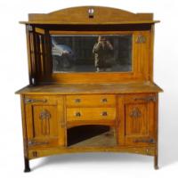 A Glasgow-Style Arts & Crafts Oak Sideboard with Stylised Cut-outs to the Top & to the Sweeping Base