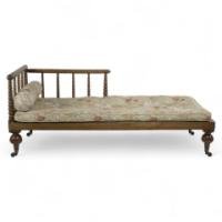 Philip Webb for Morris & Co., attributed. A Large Aesthetic Movement Bobbin Turned Satinwood Chaise Lounge