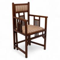 Bombay Art Furnishing Est. An Anglo-Japanese Walnut Armchair with a Double Back Leg