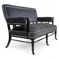 H. W. Batley, attributed. An Anglo-Japanese Settee with Japanese Fretwork Below the Backrest & to the Arms