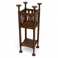 Shapland & Petter. An Arts & Crafts Oak Plant Stand with Voysey Style Discs Finials