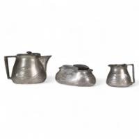 Liberty & Co., An Arts & Crafts Three Piece Tea Set with Floral Decoration