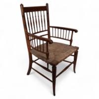 Liberty & Co., attributed. In the Style of a Morris & Co., Sussex Armchair. An Aesthetic Movement Rush Seat Armchair