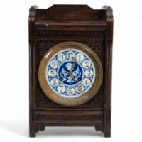 An Anglo-Japanese Carved Oak Mantel Clock with Hand Painted Blue Floral Dial