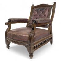 An Aesthetic Movement Walnut Library Armchair with a Curvaceous Back & Good Leather Upholstery