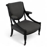 A Stylish Aesthetic Movement Ebonized & Professionally Upholstered Armchair with Sweeping Side Rails