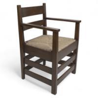 M. H. Baillie Scott by J P White. An Arts & Crafts Walnut Armchair with New Rush Seat