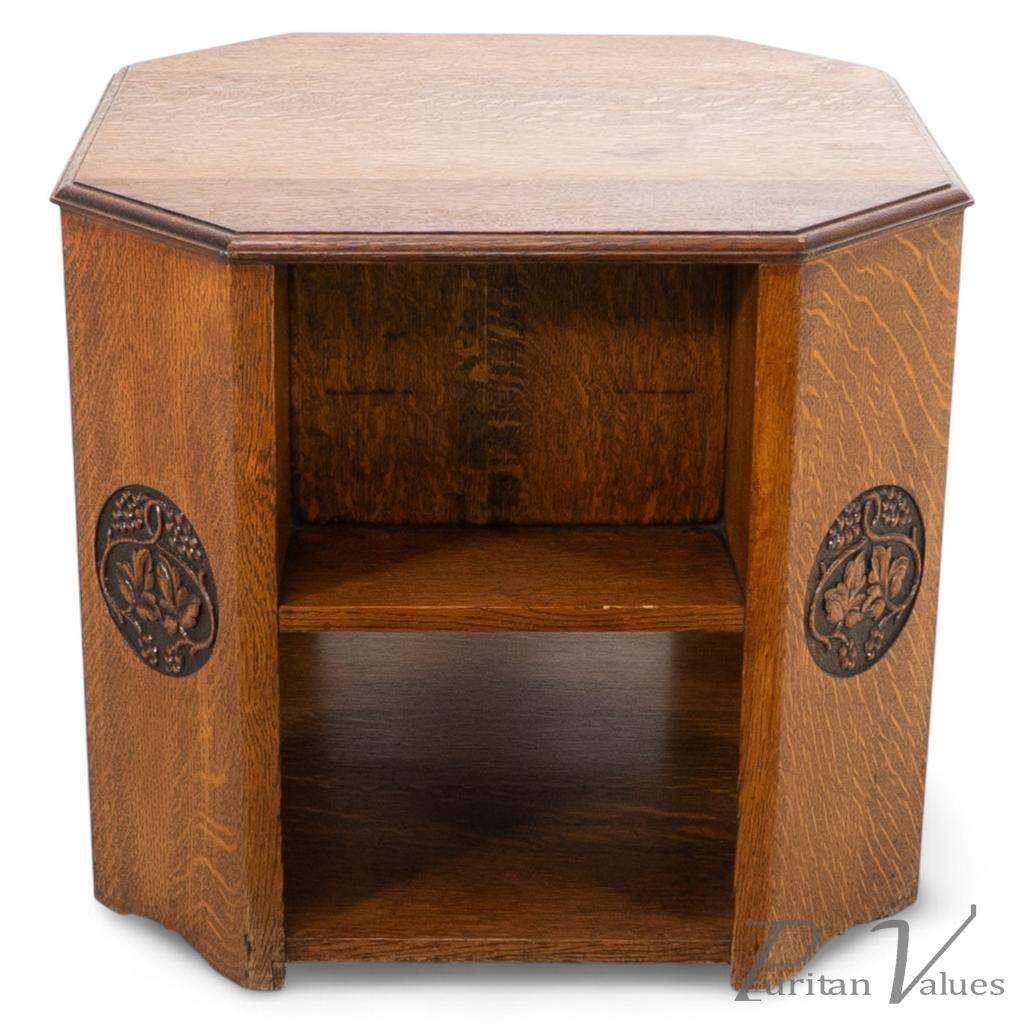 Heals. An Arts & Crafts Octagonal Oak Bookcase/side Table with Carved Decoration - Image 1