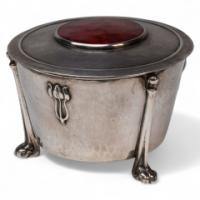 Edith Dawson. An Arts & Crafts Silver Pot with Floral Details & a Red Enamel Lid