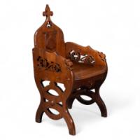 Walford & Donkin. A High Gothic Revival Oak Armchair with Carved & Fretwork Sides