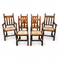 Liberty & Co., A Set of Six Arts & Crafts Oak Arrowhead Rush Seat Dining Chairs