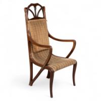 Louis Majorelle. An Art Nouveau Armchair in Carved Walnut Retaining the Original Period Fabric