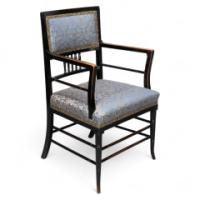 H. W. Batley or E. W. Godwin for Collinson & Lock attributed. An Aesthetic Movement Ebonized Walnut Armchair