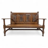 George Faulkner Armitage (1849-1937), a Carved Oak Settle with Carved Half Sunflowers