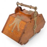 Dr. C. Dresser for Benham & Froud. An Aesthetic Movement Oak Coal Box with Brass Hinges