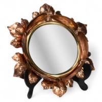An Arts & Crafts Circular Copper Bevelled Mirror in the Form of a Flower Bud