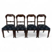 A Set of Four Aesthetic Movement Oak Dining Chairs with Carved Decoration