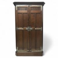 Liberty and Co (attributed). An Arts Crafts oak corner cupboard - Thumbnail 1