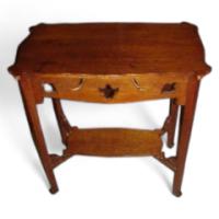 Wylie & Lochhead. An Arts & Crafts Oak Side Table with Stylised Floral Cut-outs - Thumbnail 1