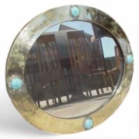 Liberty and Co. A brass mirror with four Ruskin ceramic discs rivetted into place. - Thumbnail 1