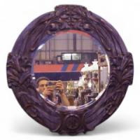 A large Arts and Crafts oak mirror with floral carving of superior craftsmanship. - Thumbnail 1