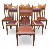 Liberty and Co (attributed). A set of seven Arts and Crafts oak dining chairs - Thumbnail 1