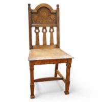 Shapland and Petter. An Arts and Crafts oak chair with arched top and wonderful Peacock inlays - Thumbnail 1