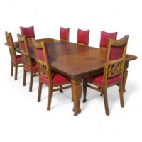Shapland and Petter. An Arts and Crafts oak 14 seater extending dining table with three leaves and eight matching chairs - Thumbnail 1